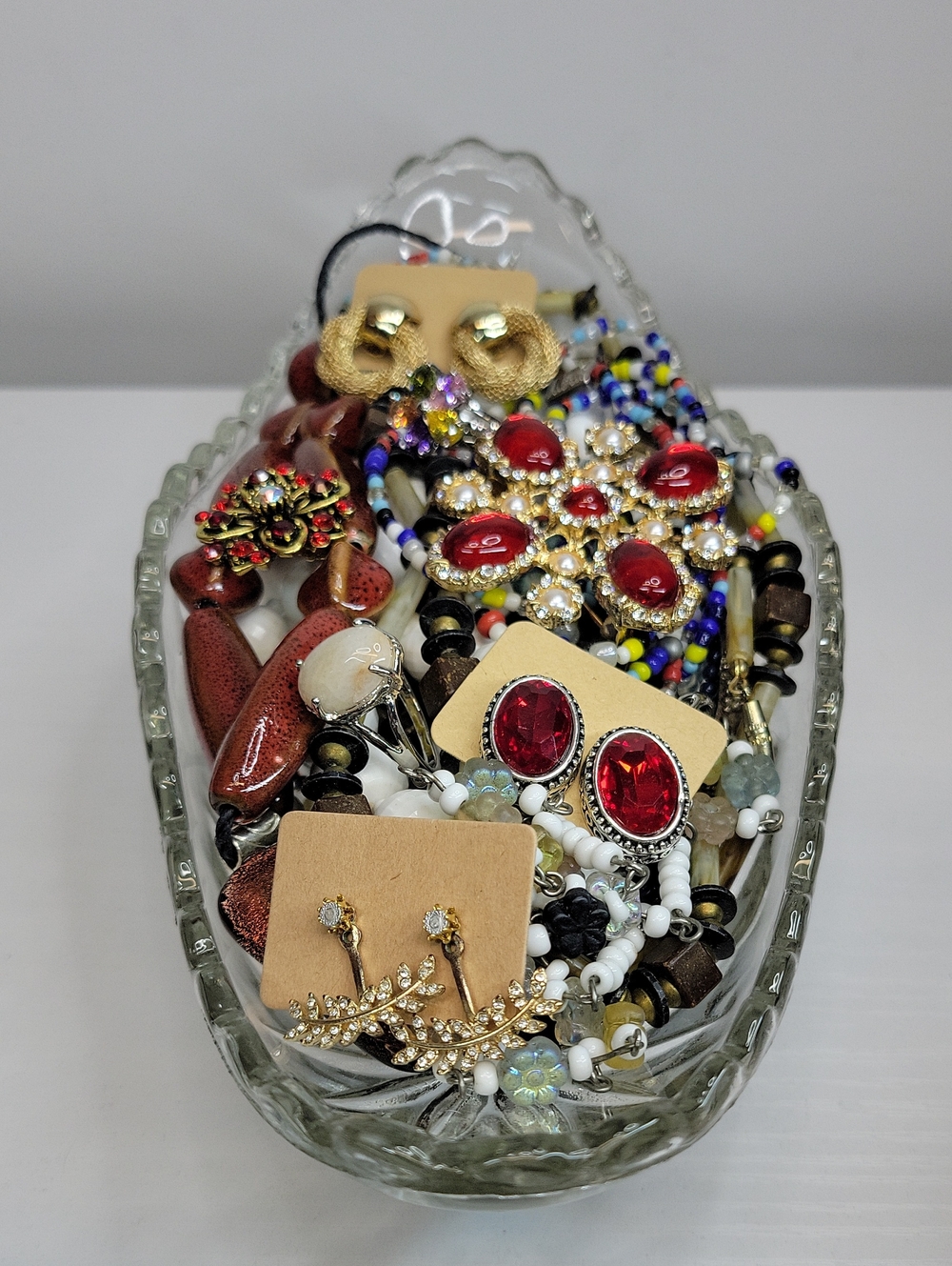 Assorted Jewelry In A Glass Dish